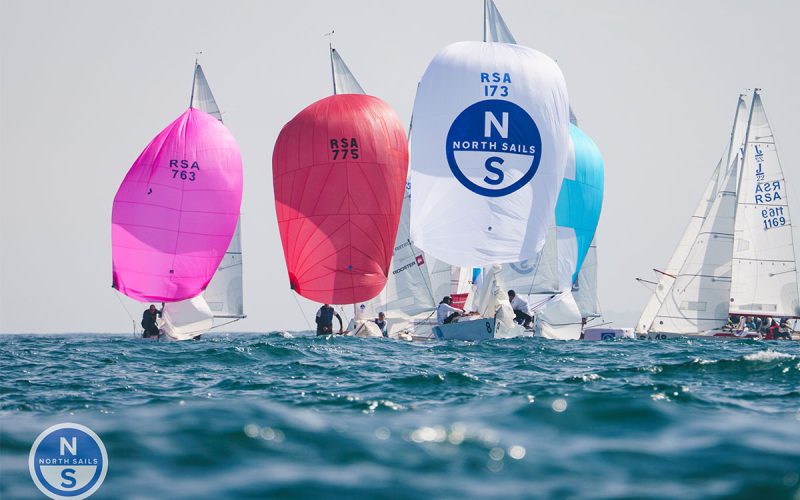 The J22 fleet racing under spinnaker in Table Bay